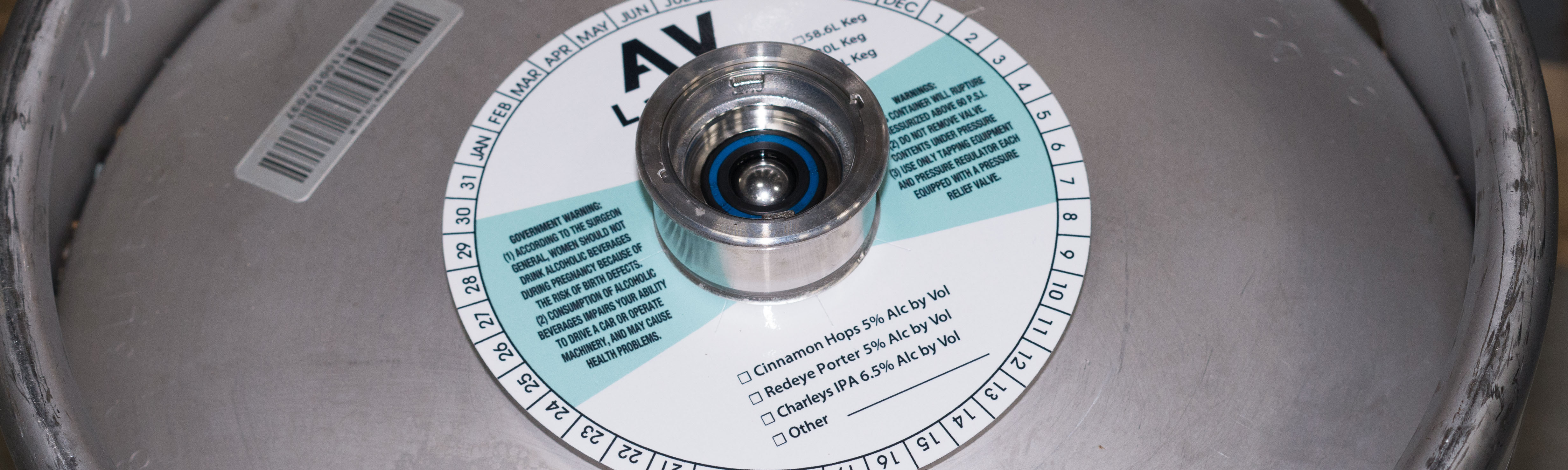 picture of a keg with keg collar, keg label and other branding